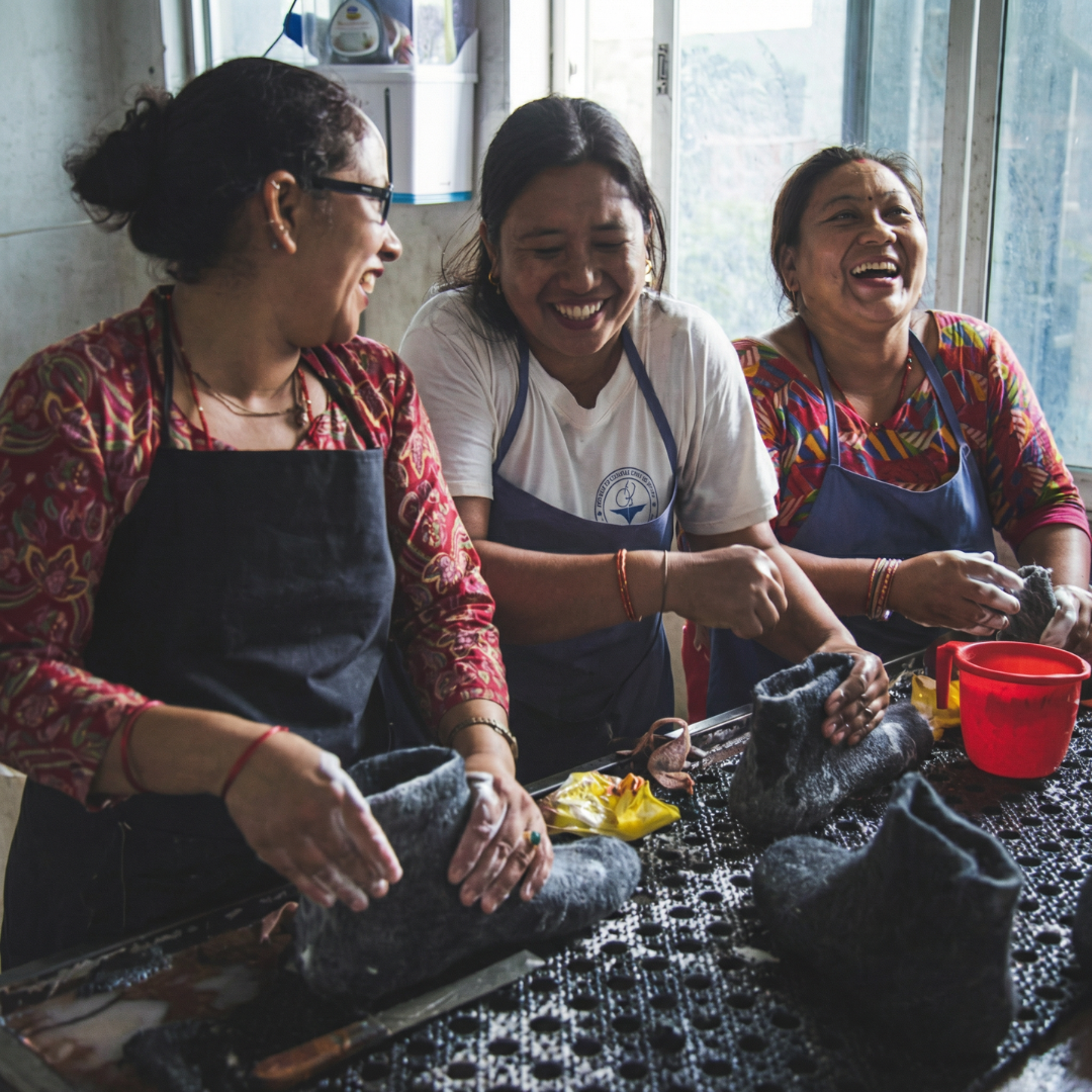 SHUS artisans crafting felted wool footwear by hand